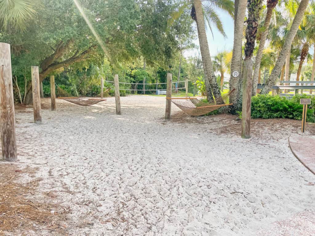 beach area with hammocks and volleyball at Old Key West.
