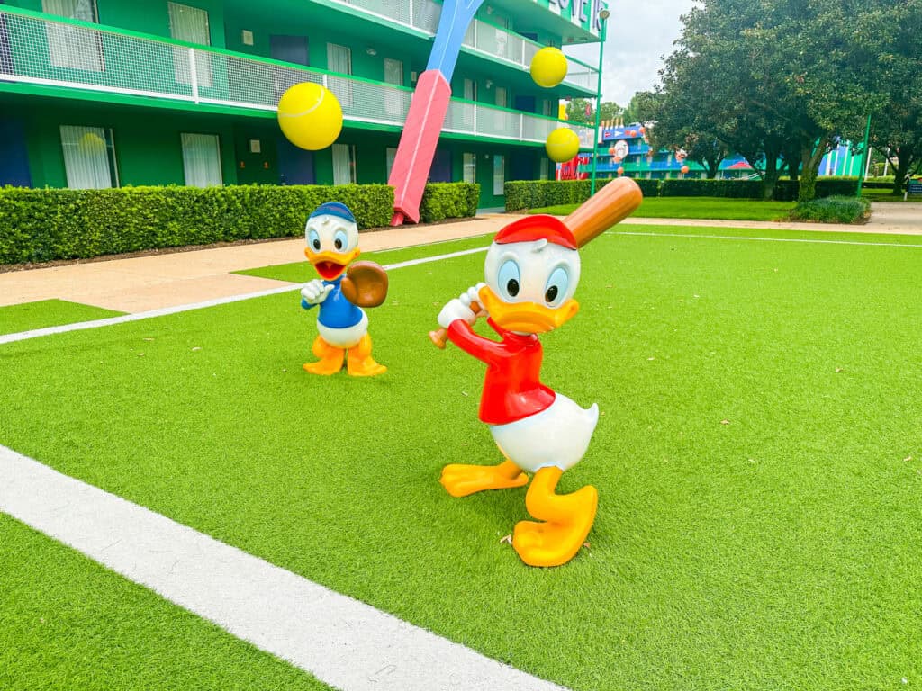 Huey and Dewey playing baseball on the tennis court.