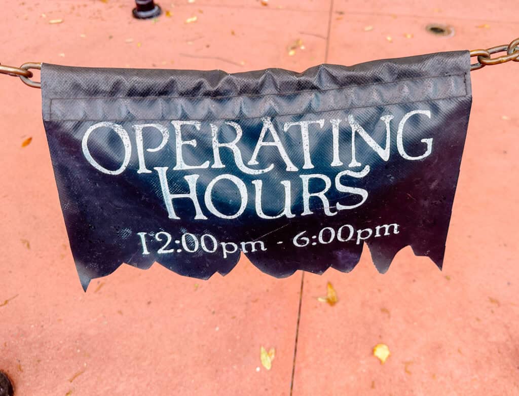 sign showing the operating hours of the Pirate Adventure.