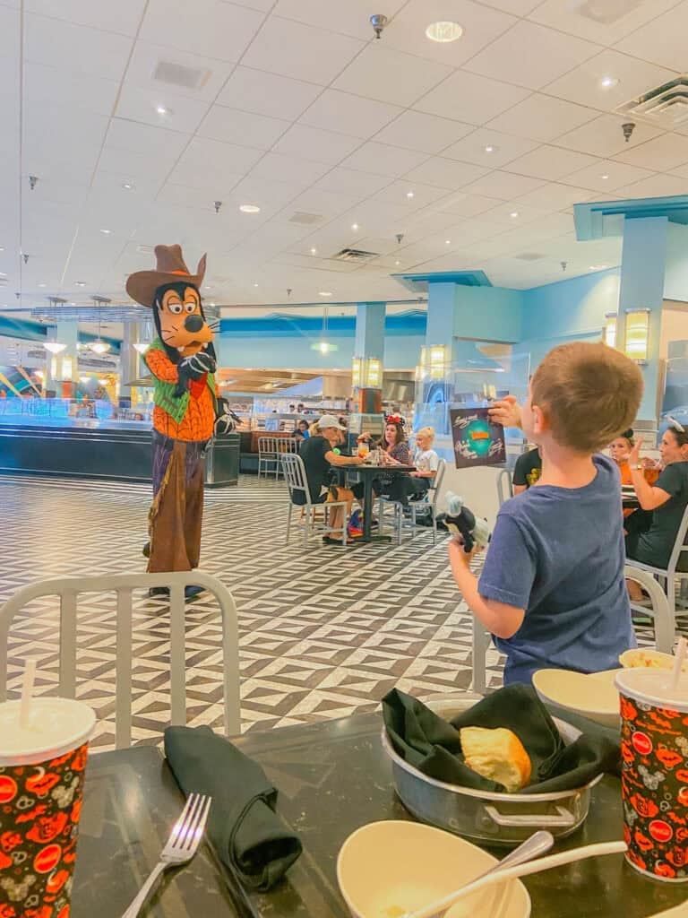 interacting with Goody during Minnie's Halloween Dine.