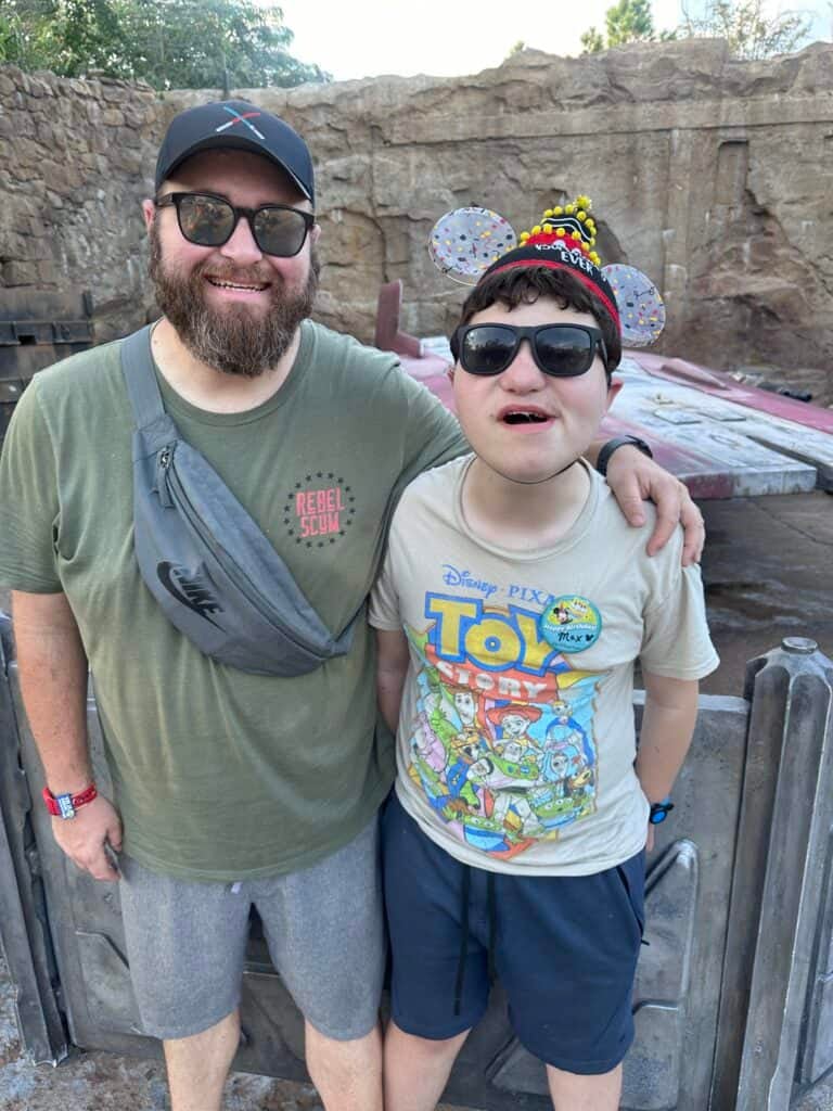 Max wearing a birthday hat and pin at Hollywood Studios.